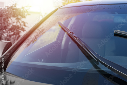 Brushes on the windshield with copy space. The concept of cleaning agent, polishing, nanocoatings photo