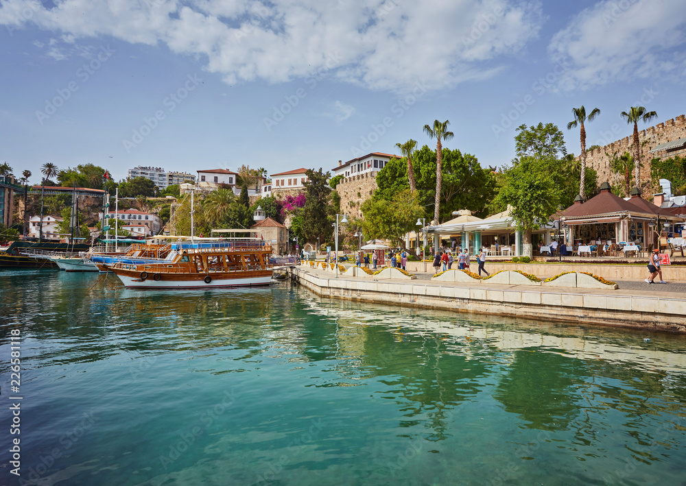 Fototapeta premium Aerial view of yacht harbor and red house roofs in Old town timelapse Antalya, Turkey.