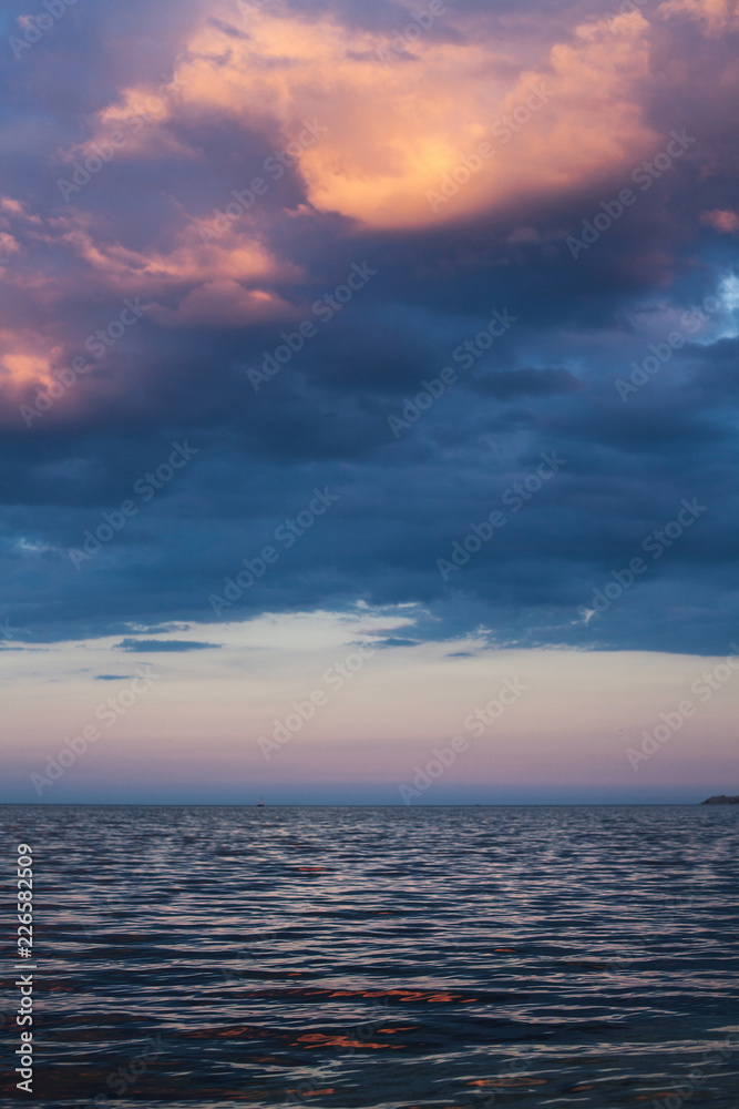 View of beautiful clouds in the evening at sunset from the sea s