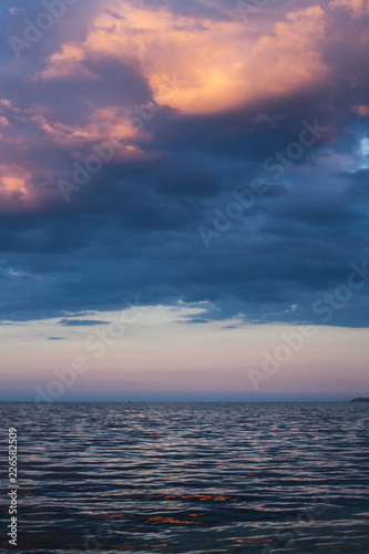 View of beautiful clouds in the evening at sunset from the sea s
