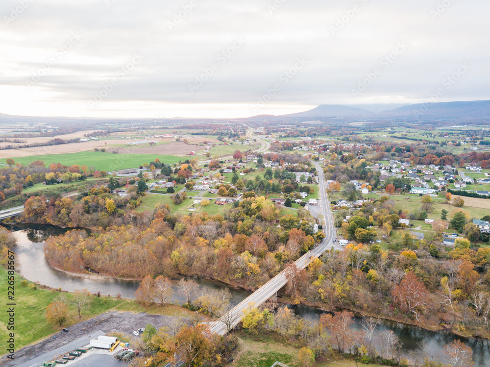 Fototapeta premium Aerial of the small town of Elkton, Virginia in the Shenandoah Valley with Mountains in the Distance