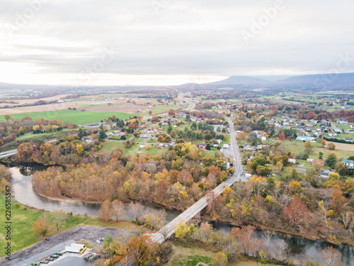 Fototapeta Naklejka Na Ścianę i Meble -  Aerial of the small town of Elkton, Virginia in the Shenandoah Valley with Mountains in the Distance
