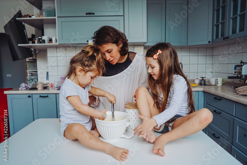Happy family cook together in the kitchen