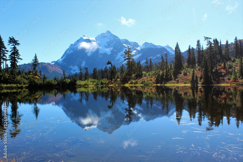 Stunning view of Mount Shuksan and its reflection in Picture Lake on a tranquil morning in September