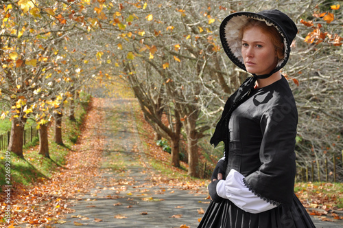 Victorian woman in autumn scene photo