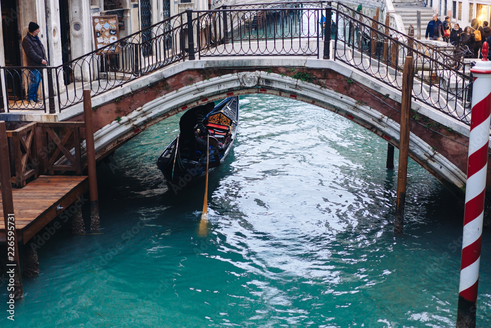 Gondolas on lateral narrow Canal, Venice, Italy.