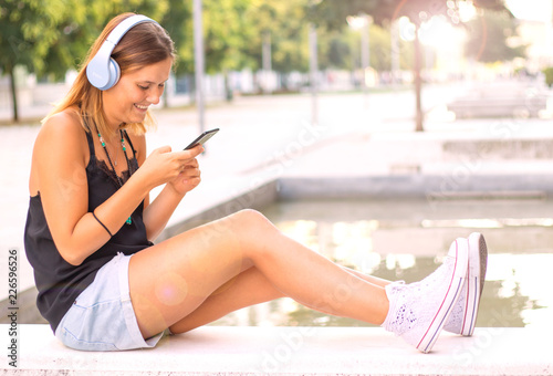 beautiful woman listening music with headphone