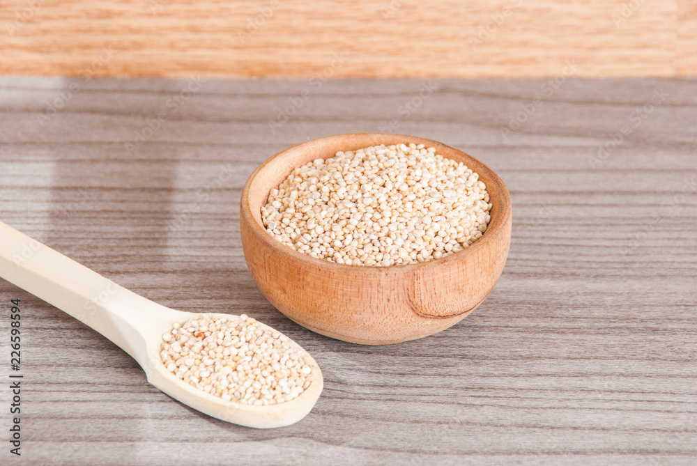 Grains of quinua on wood - Chenopodium quinoa Grains of quinua on wood - Chenopodium quinoa