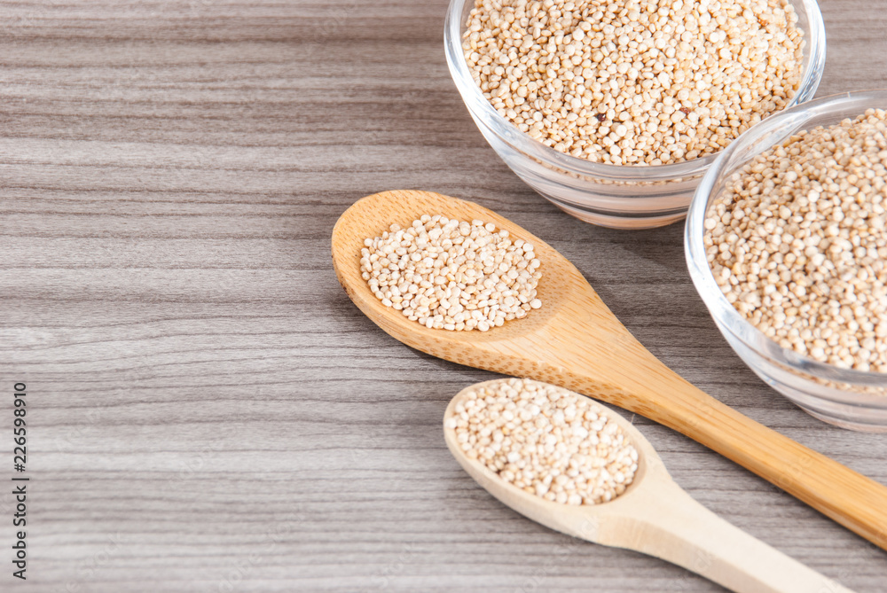Grains of quinua on wood - Chenopodium quinoa Grains of quinua on wood - Chenopodium quinoa