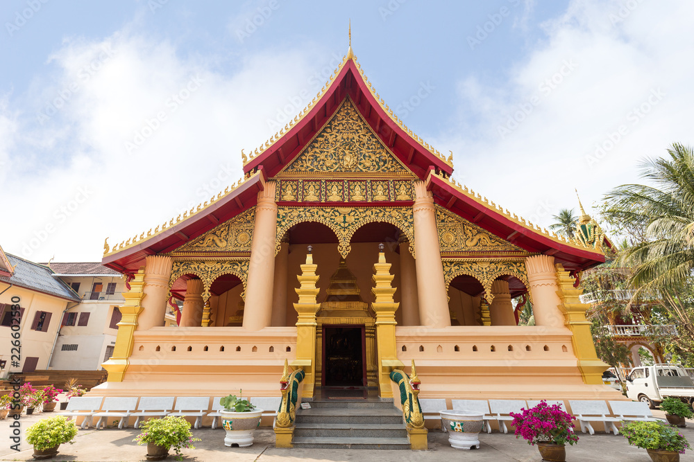 Wat Ong Teu Mahawihan (Temple of the Heavy Buddha), a Buddhist monastery, in Vientiane, Laos, on a sunny day.