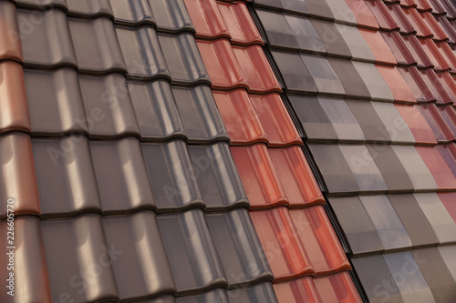 Roof tiles of various shapes and colors. Roofing.