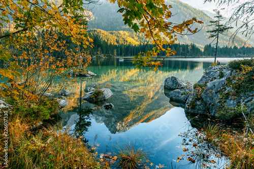 Fototapeta Naklejka Na Ścianę i Meble -  Wonderful Autumn Landscape. Summer mountain Scenery. Sunny Day on Hintersee Lake. Majestic Mountains, reflected in Water. Beauty in the nature. Nationalpark Berchtesgadener Land, Bavaria, Germany