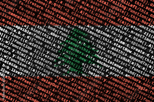 Lebanon flag  is depicted on the screen with the program code. The concept of modern technology and site development photo