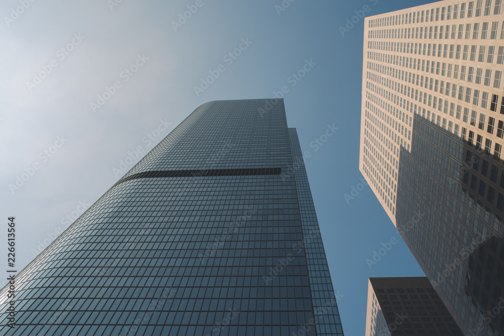 Low view of very tall sky scrapers in the daylight