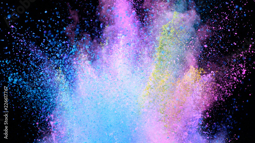 Multi-color powder explosion on black background