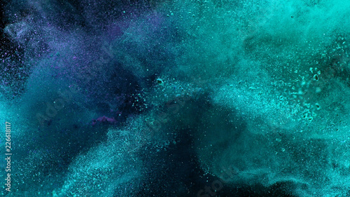 Multi-color powder explosion on black background