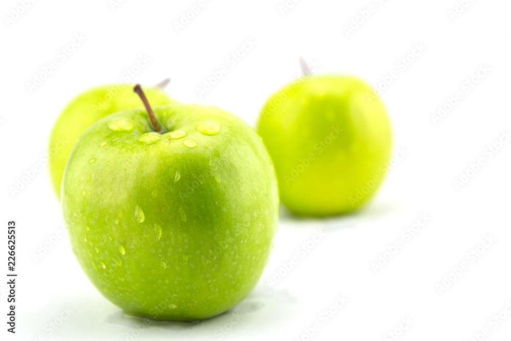 Ripe green apple with slices isolated on white background