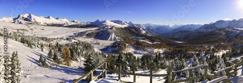 Wide Panoramic Landscape of Snow covered Sunshine Meadows and Distant Mountain Peaks from Standish Viewpoint in Banff National Park photo