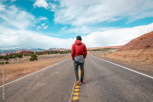 Man walking on road in Utah