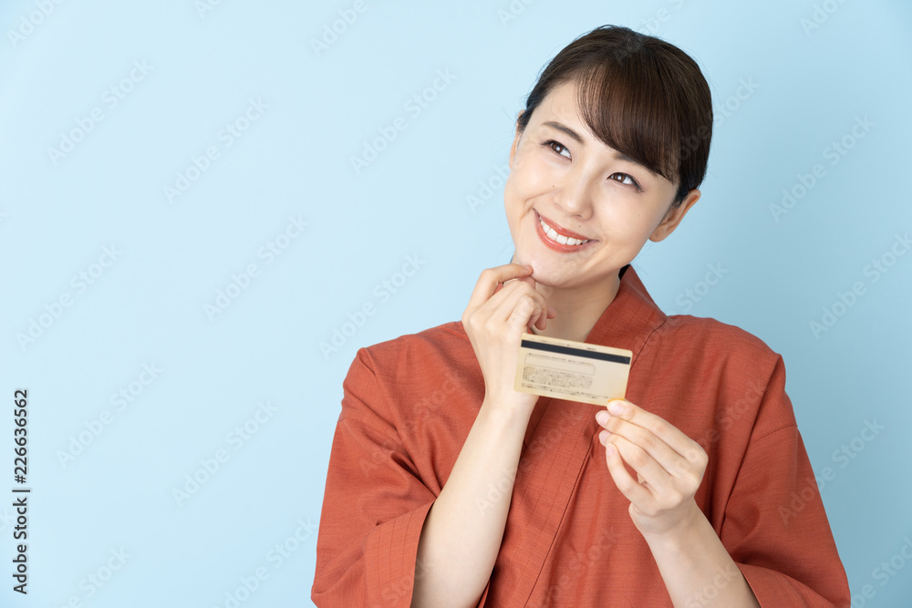 portrait of japanese style waitress isolated on blue background portrait of japanese style waitress isolated on blue background