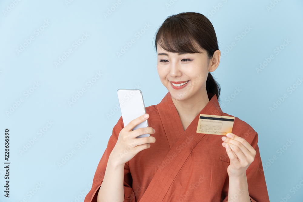 portrait of japanese style waitress isolated on blue background portrait of japanese style waitress isolated on blue background