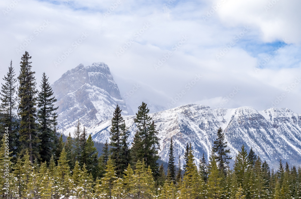 Sunshine on Snow Covered Peaks in Autumn