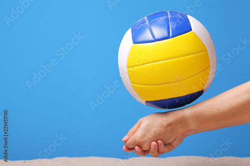 Hands of a beach volleyball female player digging a ball