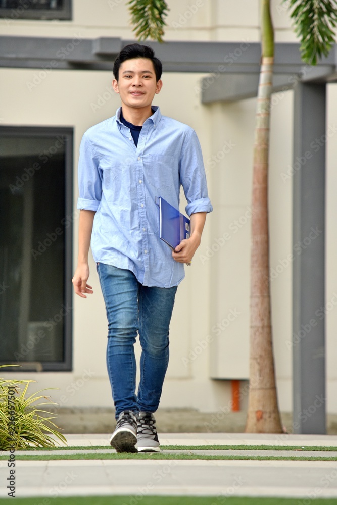 Handsome Male Student Walking On Campus Handsome Male Student Walking On Campus