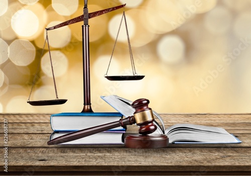 Justice Scales and books and wooden gavel