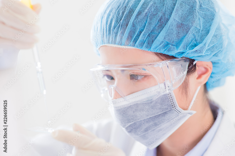 Fototapeta premium scientist take microscope slide