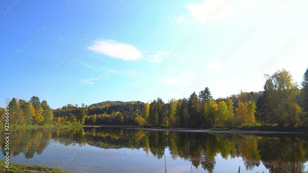 Mountain lake. Fall. Reflection of trees in water. Mountain lake. Fall. Reflection of trees in water.