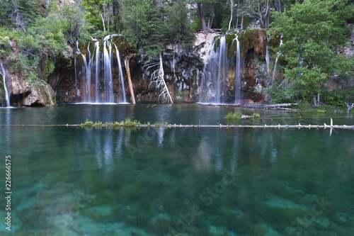 Fototapeta Naklejka Na Ścianę i Meble -  Colorado mountain waterfall with lots of fresh green scenery