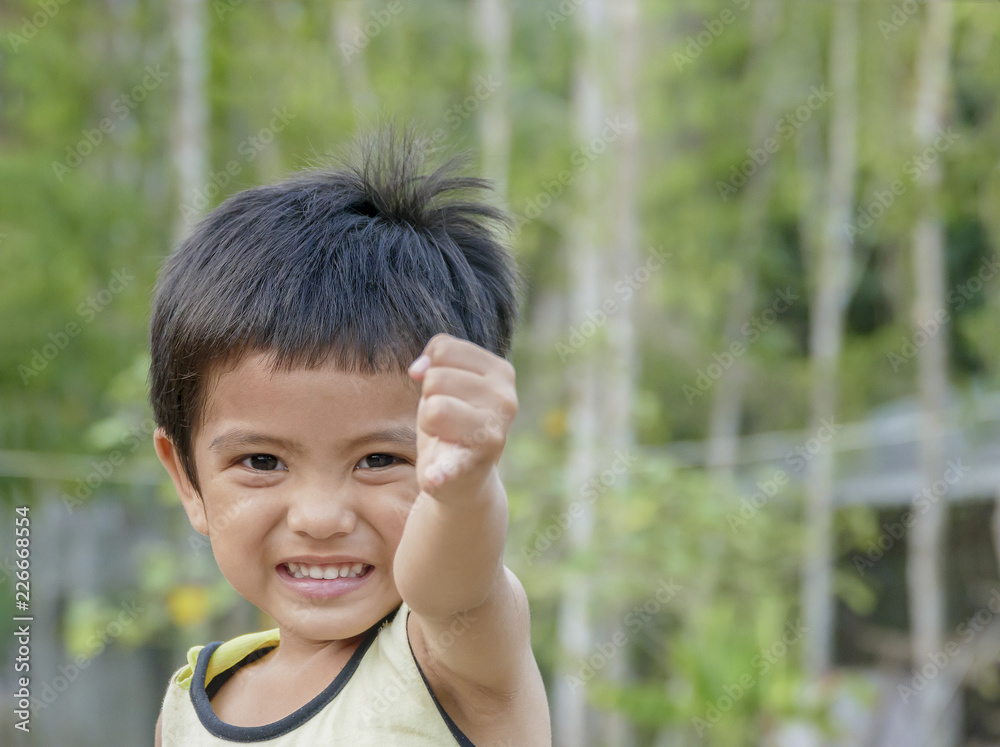 Asian little boy show pinkie finger Asian little boy show pinkie finger