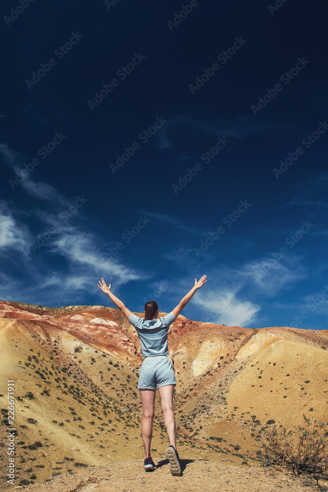 Woman in valley of Mars landscapes in the Altai Mountains, Kyzyl Chin, Siberia, Russia Woman in valley of Mars landscapes in the Altai Mountains, Kyzyl Chin, Siberia, Russia