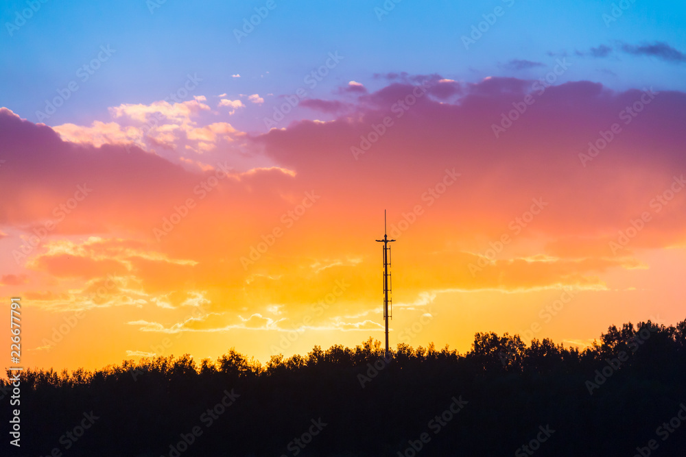 Silhouette of tower and tree at sunset Silhouette of tower and tree at sunset
