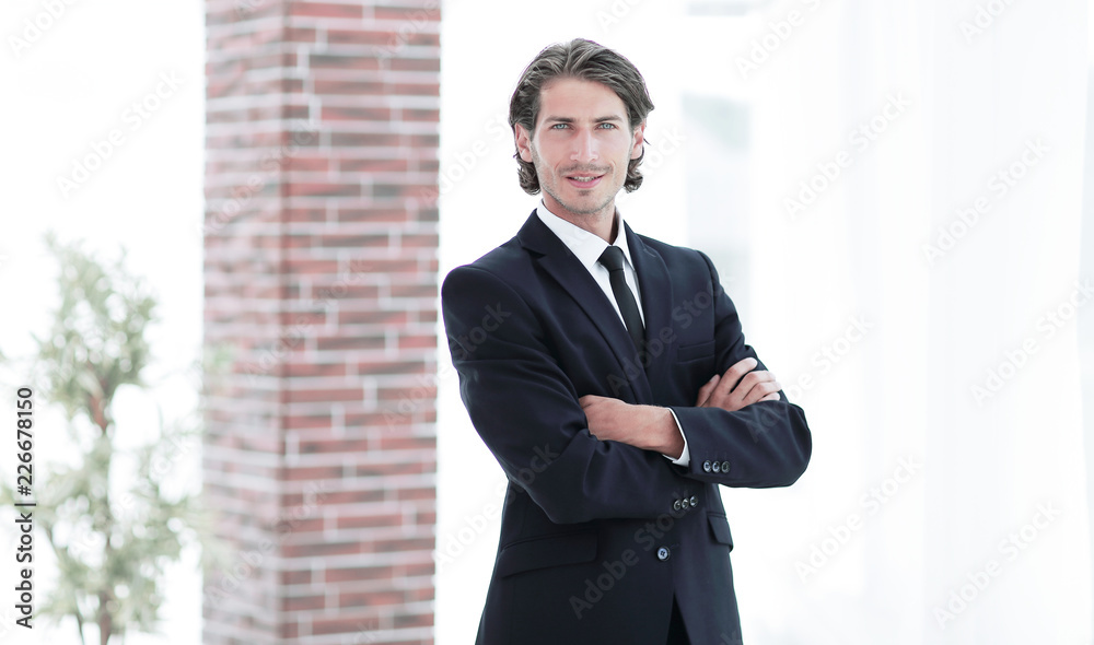 confident business man on background of office. confident business man on background of office.