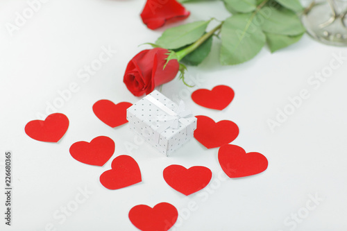 Valentine's day gift box on red rose background . photo with cop