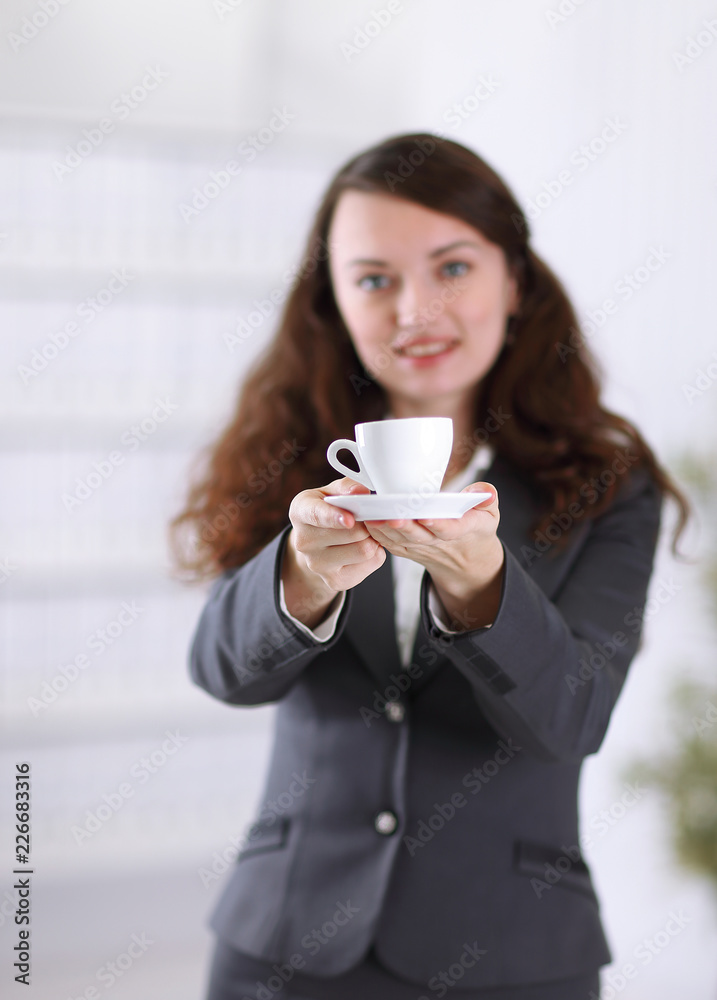 closeup.friendly business woman with a Cup of coffee closeup.friendly business woman with a Cup of coffee
