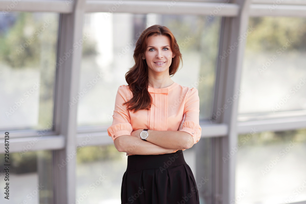 close up.portrait of modern young woman on blurred office background. close up.portrait of modern young woman on blurred office background.