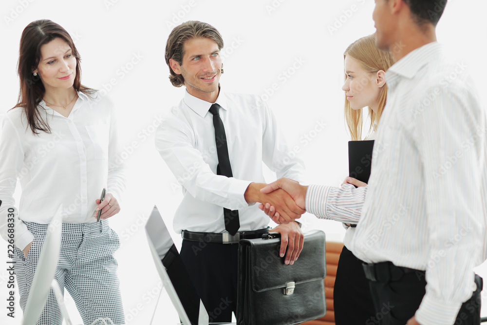 handshake between lawyer and client in a modern office handshake between lawyer and client in a modern office