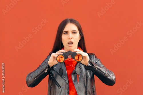 Visionary Millennial Girl Looking through Binoculars 