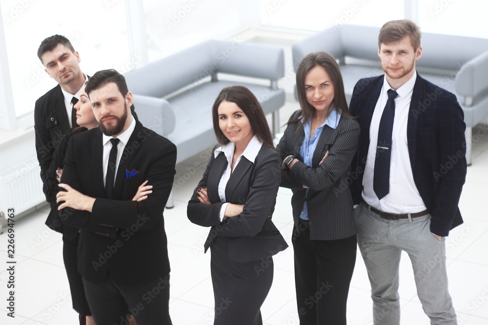 close up.a group of successful business people standing in the office hall close up.a group of successful business people standing in the office hall