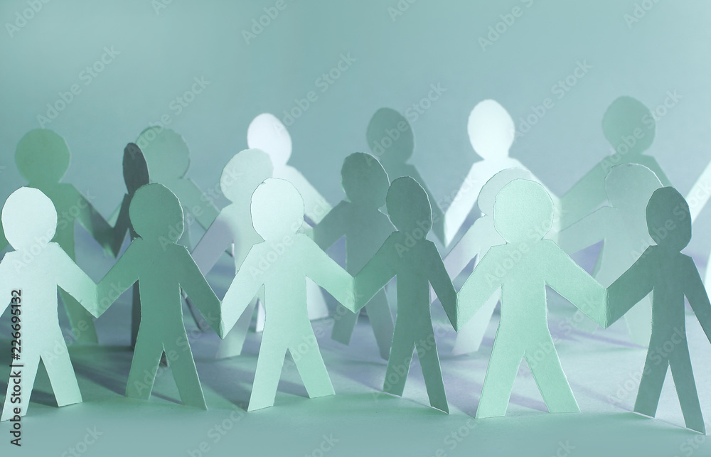 concept of teamwork.team paper men standing. photo with copy space. concept of teamwork.team paper men standing. photo with copy space.
