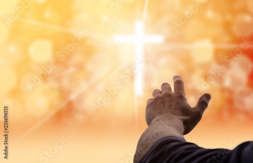 Male hand with cross of lights