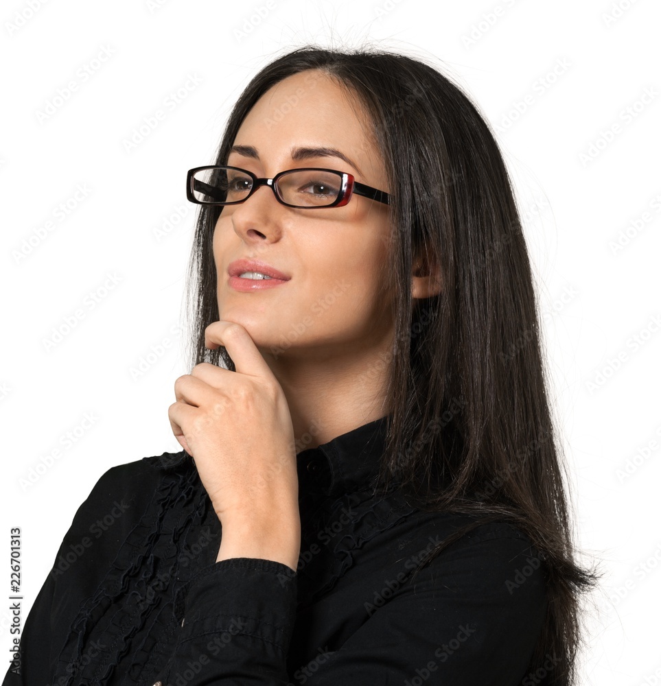 Young woman wearing glasses with her hand on her chin Young woman wearing glasses with her hand on her chin