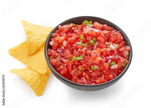 Tomato salsa dip top view isolated on white background photo