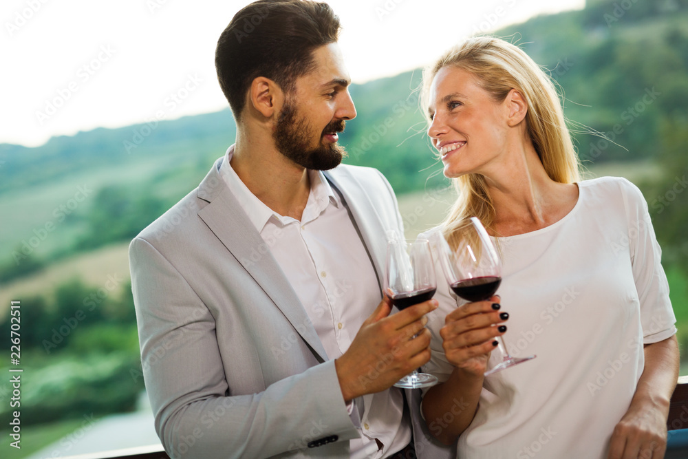 Picture of people tasting red wine in vineyard Picture of people tasting red wine in vineyard