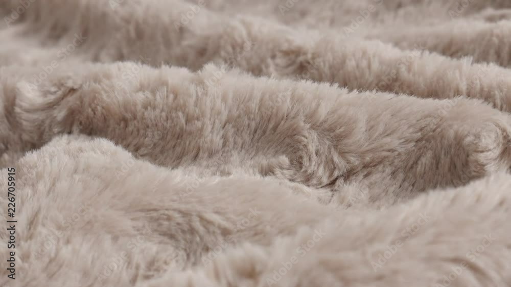 Slow pan over brown blanket made of faux fur fleece 4K video Slow pan over brown blanket made of faux fur fleece 4K video