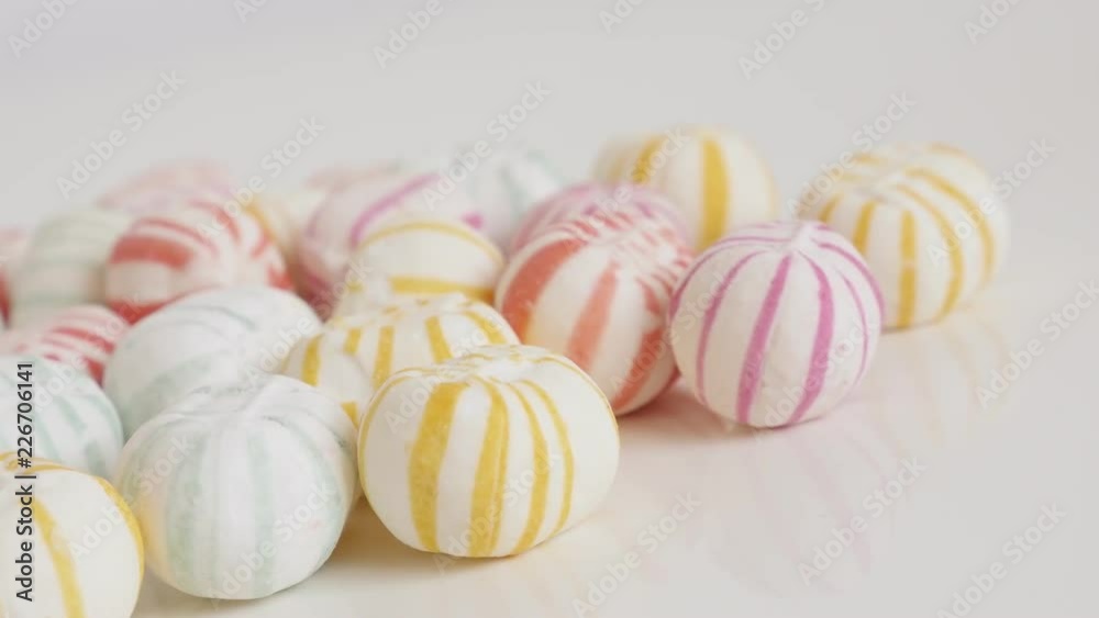 Sugar bonbons with stripes close-up slow pan 4K video Sugar bonbons with stripes close-up slow pan 4K video
