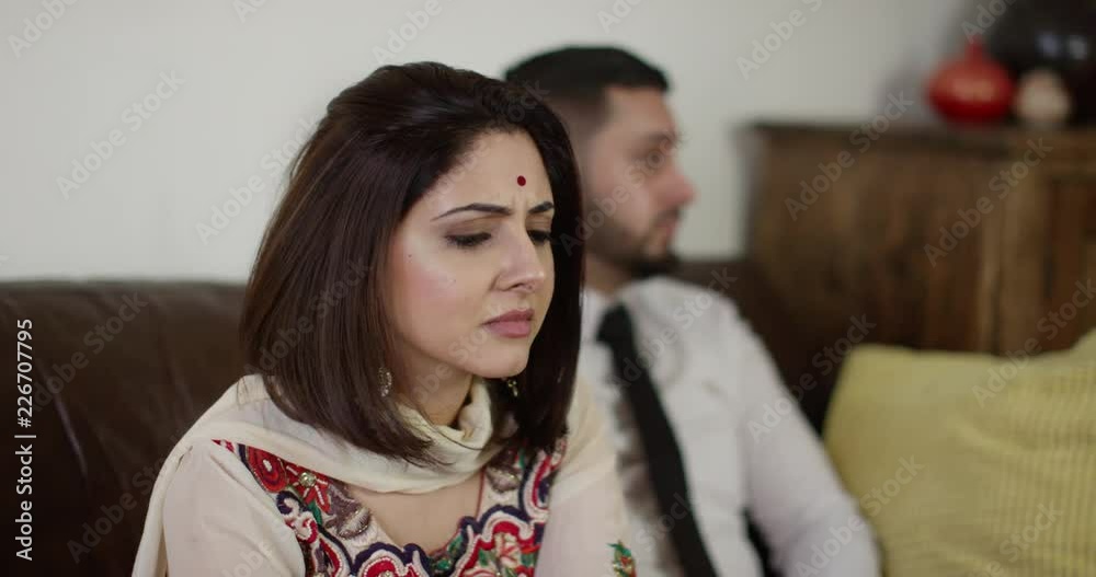 4K Young Indian couple not speaking after a fight, with focus on woman in traditional dress. Slow motion. 4K Young Indian couple not speaking after a fight, with focus on woman in traditional dress. Slow motion.